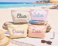 Personalized embroidered seersucker makeup bag gift set at the beach