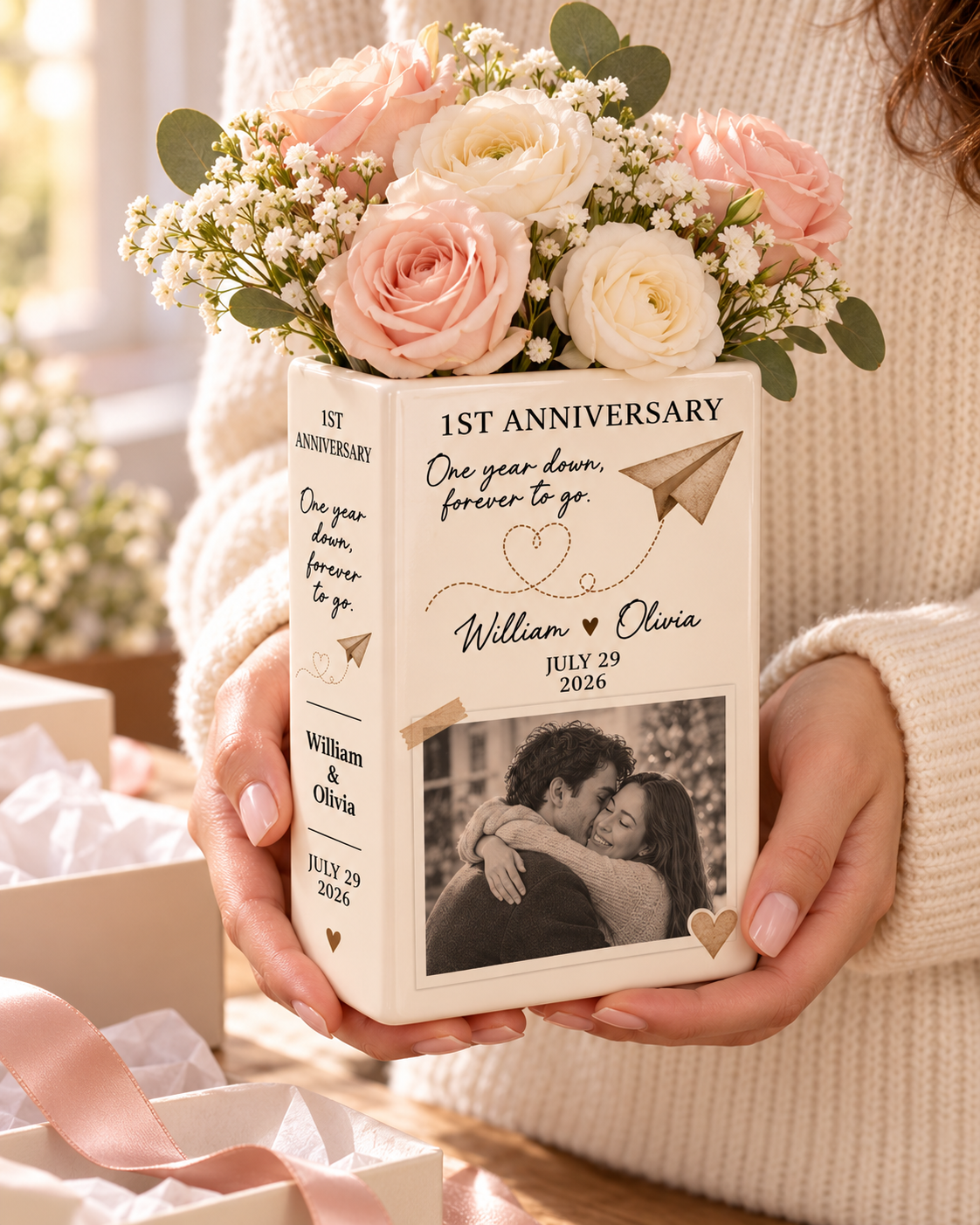 Personalized first anniversary book vase held as a romantic gift