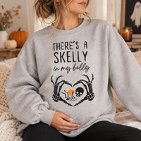 There's a Skelly in My Belly maternity sweatshirt and hoodie mockup 8