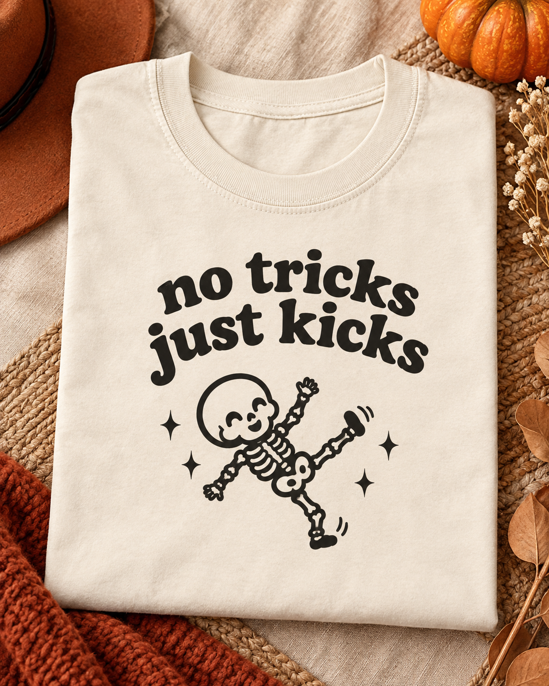 No Tricks Just Kicks baby skeleton tee flat lay in Ivory