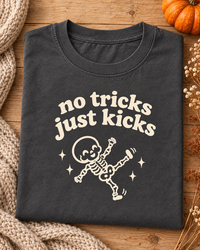 No Tricks Just Kicks skeleton pregnancy tee flat lay in Pepper