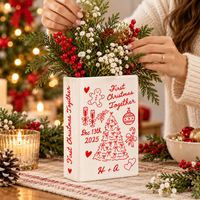 First Christmas Together book vase being arranged with holiday flowers