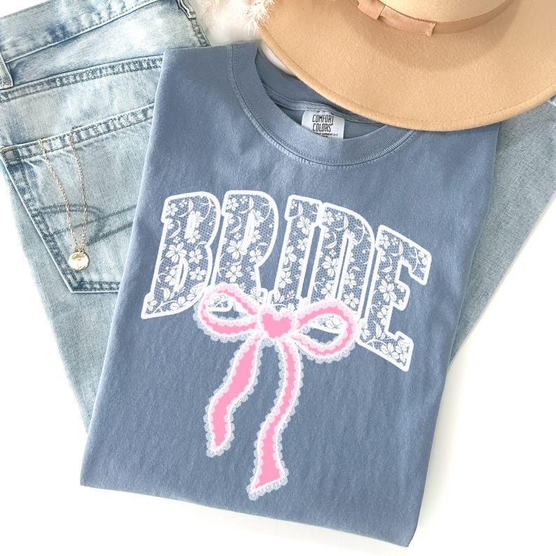 Bride Shirt with Bow, Lace Varsity Bride Tee, Coquette Bride Shirt, Comfort Colors Wedding Shirt, Engagement Gift Shirt, Pink Bow Bride Tee
