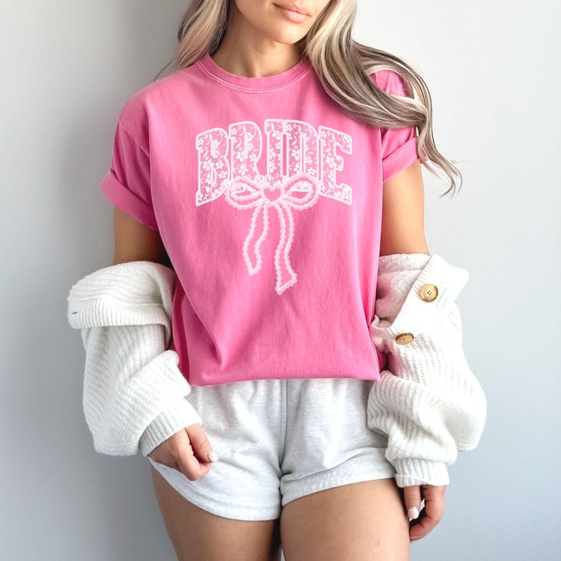 Bride Shirt with Bow, Lace Varsity Bride Tee, Coquette Bride Shirt, Comfort Colors Wedding Shirt, Engagement Gift Shirt, Pink Bow Bride Tee